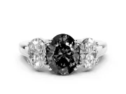 Fancy Black Oval Cut Diamond Three-Stone Ring Set in White gold with Polished Band and Prong Setting