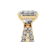 Emerald Cut Diamond Three-Stone Ring Set in Yellow gold with Pavé Split Shank and Prong Setting