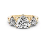 Heart Cut Diamond Three-Stone Ring Set in Yellow gold with Bold Center and Classic Band