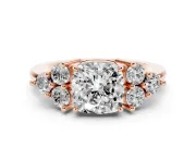 Cushion Cut Diamond Solitaire Ring Set in Rose gold with Cluster Accents on Each Side