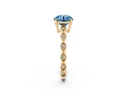 Fancy Blue Round Cut Diamond Solitaire Ring Set in Yellow gold with Infinity Twist Pavé Band