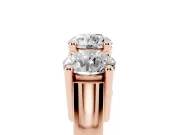 Round Cut Diamond Three-Stone Ring Set in Rose gold with Channel Band and Sturdy Prongs