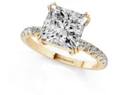 Princess Cut Diamond Brilliant Solitaire Set in Yellow gold with Pavé Band and Claw Prong Setting