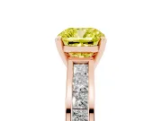 Fancy Yellow Cushion Cut Diamond Solitaire Ring Set in Rose gold with Channel-Set Band and Prong Setting