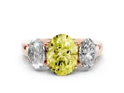 Fancy Yellow Oval Cut Diamond Three-Stone Ring Set in Rose gold with Bold Center and Classic Band