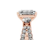 Emerald Cut Diamond Three-Stone Ring Set in Rose gold with Pavé Split Shank and Prong Setting
