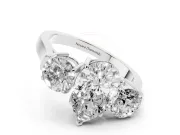 Pear Cut Diamond Three-Stone Ring Set in White gold with Round Accent Stones and Plain Band