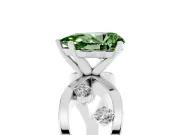 Fancy Green Pear Cut Diamond Solitaire Ring Set in White gold with Side Stones on Criss-Cross Band and Prong Setting