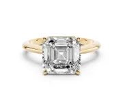 Asscher Cut Diamond Solitaire Ring Set in Yellow gold with Prong Setting on a Plain Round Band
