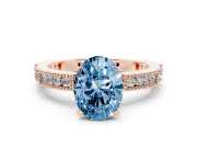 Fancy Blue Oval Cut Diamond Solitaire Ring Set in Rose gold with Slim Pavé Band and Prong Setting