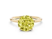 Fancy Yellow Round Cut Diamond Solitaire Engagement Ring Set in Yellow gold with Thin Band and Prong Setting