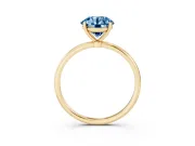 Fancy Blue Round Cut Diamond Solitaire Engagement Ring Set in Yellow gold with Thin Band and Prong Setting