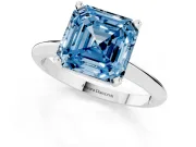Fancy Blue Asscher Cut Diamond Solitaire Ring Set in Silver with Prong Setting on a Plain Round Band