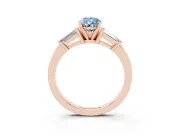 Fancy Blue Pear Cut Diamond Solitaire Ring Set in Rose gold with Tapered Baguette Accents and Prong Setting