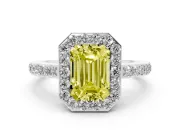 Fancy Yellow Emerald Cut Diamond Halo Ring Set in White gold with Pavé-Setting Band and Open Prong Center