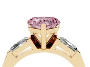 Fancy Pink Heart Cut Diamond Solitaire Ring Set in Yellow gold with Tapered Baguette Side Stones and Prong Setting