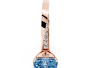 Fancy Blue Radiant Cut Diamond Engagement Ring Set in Rose gold with Side Stone Accents and Prong Setting