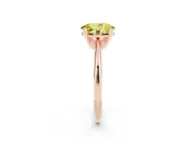 Fancy Yellow Oval Cut Diamond Solitaire Ring Set in Rose gold with Prong Setting on a Plain Round Band