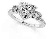 Heart Cut Diamond Three-Stone Ring Set in Platinum with Pavé Band and Graduated Sides