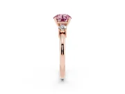 Fancy Pink Three-Stone Round Cut Diamond Ring Set in Rose gold with Prong Setting and Plain Band
