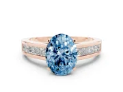 Fancy Blue Oval Cut Diamond Solitaire Ring Set in Rose gold with Channel-Set Band and Prong Setting