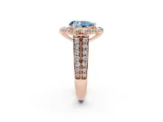 Fancy Blue Pear Cut Diamond Halo Engagement Ring Set in Rose gold with Split Shank and Prong Setting