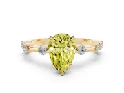 Fancy Yellow Pear Cut Diamond Solitaire Ring Set in Yellow gold with Bezel Set Side Stones and Prong Setting