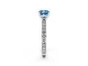 Fancy Blue Cushion Cut Diamond Solitaire Ring Set in Platinum with Slim Pavé Band and Prong Setting