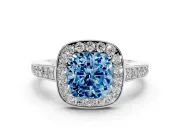 Fancy Blue Cushion Cut Diamond Halo Pavé Engagement Ring Set in Platinum with Bezel Setting