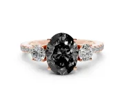Fancy Black Oval Cut Diamond Three-Stone Ring Set in Rose gold with Pavé Band and Graduated Sides
