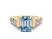 Fancy Blue Emerald Cut Diamond Classic Solitaire Ring Set in Yellow gold with Pavé Band and Prong Setting