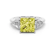Fancy Yellow Three-Stone Princess Cut Diamond Ring Set in Platinum with Pear Side Stones and Prong Setting