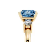 Fancy Blue Three-Stone Princess Cut Diamond Ring Set in Yellow gold with Prong Setting and Plain Band