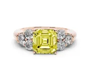 Fancy Yellow Asscher Cut Diamond Cluster Ring Set in Rose gold with Round Accent Stones and Prong Setting on a Plain Band