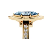 Fancy Blue Marquise Cut Diamond Halo Solitaire Ring Set in Yellow gold with Pavé Band and Bezel Setting