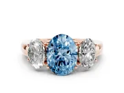 Fancy Blue Oval Cut Diamond Three-Stone Ring Set in Rose gold with Bold Center and Classic Band