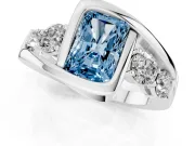 Fancy Blue Radiant Cut Diamond Bezel Bypass Ring Set in White gold with Round Accents
