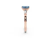 Fancy Blue Emerald Cut Diamond Solitaire Ring Set in Rose gold with Tapered Baguette Accents and Prong Setting
