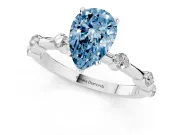 Fancy Blue Pear Cut Diamond Solitaire Ring Set in Silver with Bezel Set Side Stones and Prong Setting