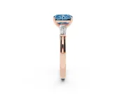 Fancy Blue Radiant Cut Diamond Solitaire Ring Set in Rose gold with Tapered Baguette Side Stones and Prong Setting