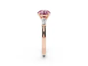 Fancy Pink Round Cut Diamond Solitaire Ring Set in Rose gold with Tapered Baguette Side Stones and Prong Setting
