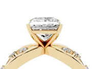 Princess Cut Diamond Solitaire Ring Set in Yellow gold with Side Stones on Criss-Cross Band and Prong Setting