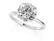 Round Cut Diamond Solitaire Engagement Ring Set in Platinum with Thin Band and Prong Setting