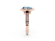 Fancy Blue Pear Cut Diamond Halo Solitaire Ring Set in Rose gold with Pavé Band and Bezel Setting