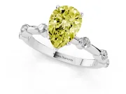 Fancy Yellow Pear Cut Diamond Solitaire Ring Set in White gold with Bezel Set Side Stones and Prong Setting