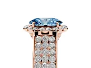 Fancy Blue Oval Cut Diamond Halo Ring Set in Rose gold with Pavé Band and Raised Center Setting