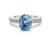Fancy Blue Oval Cut Diamond Solitaire Ring Set in Silver with Slim Pavé Band and Prong Setting
