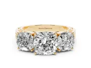 Cushion Cut Diamond Three-Stone Ring Set in Yellow gold with Textured Band