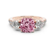 Fancy Pink Cushion Cut Diamond Three-Stone Ring Set in Rose gold with Round Side Stones and Delicate Pavé Band
