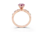 Fancy Pink Round Cut Diamond Solitaire Ring Set in Rose gold with Side Stones on Criss-Cross Band and Prong Setting